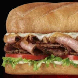 Prime Rib Steak Sub with prime rib, smoked turkey, Virginia honey ham, and melted Monterey Jack